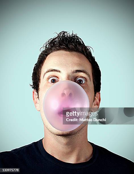 portrait of man with bubble - bubble gum bubble stock pictures, royalty-free photos & images