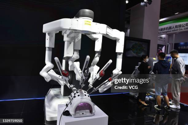 Da Vinci surgical robot is on display at the booth of Intuitive Surgical - Fosun Medical Technology Co., Ltd during 2021 World Robot Conference at...