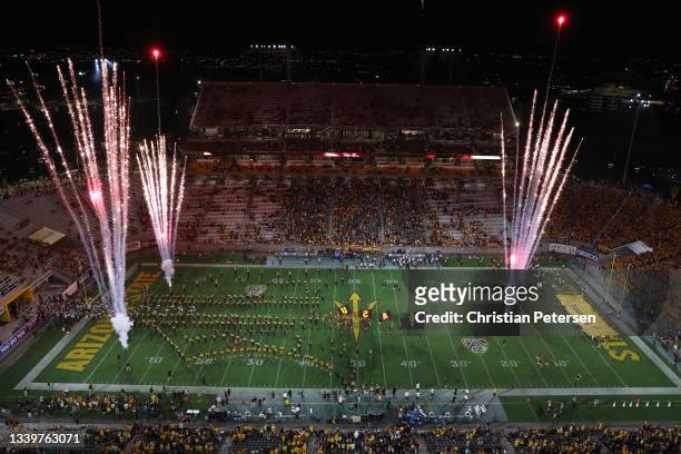 The Arizona State Sun Devils run onto the field before the start of the NCAAF game against the UNLV Rebels at Sun Devil Stadium on September 11, 2021...
