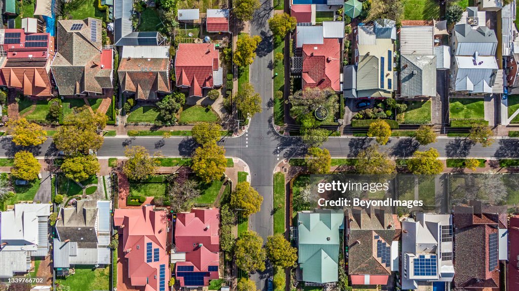 Aerial view of leafy eastern suburban houses on 4-way cross road intersection in Adelaide, South Australia