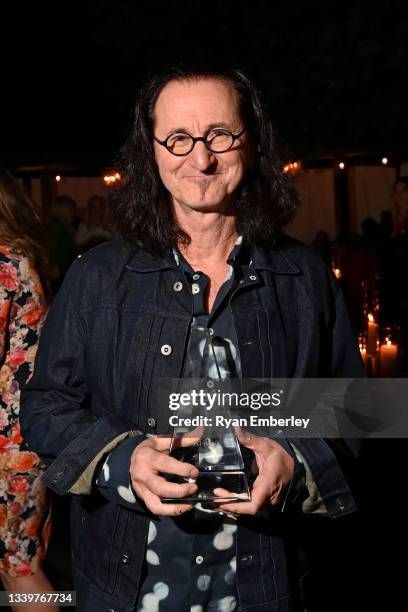 Geddy Lee poses with the Lifetime Achievement Award at the 13th Annual Artists for Peace and Justice Fundraiser during Toronto International Film...