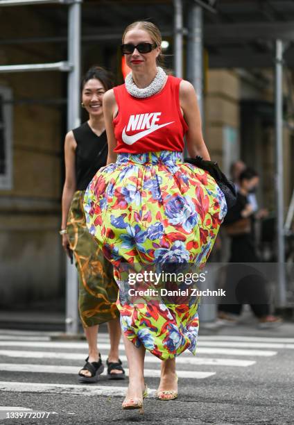 Chloe King is seen wearing a Nike top and Rodarte floral skirt outside the Rodarte show during New York Fashion Week S/S 22 on September 11, 2021 in...