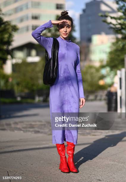 Mary Leest is seen wearing a purple Jonathan Simkhai dress and red boots outside the Jonathan Simkhai show during New York Fashion Week S/S 22 on...