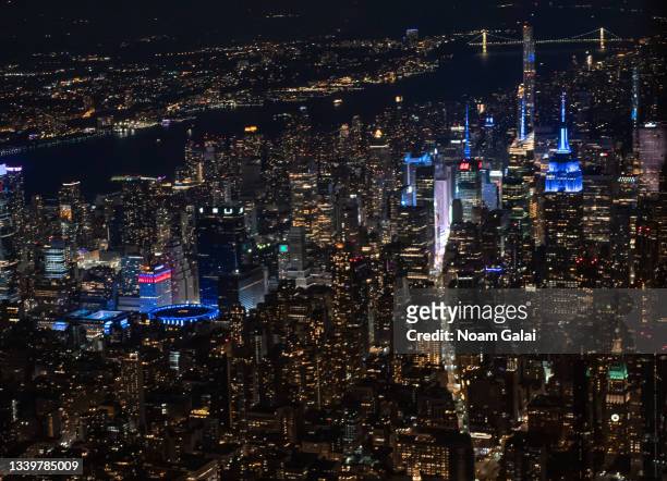 Midtown buildings lit in blue to mark the 20th anniversary of the 9/11 terrorist attacks at the World Trade Center, on September 11, 2021 in New York...