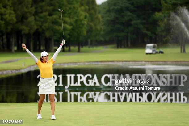 Mone Inami of Japan celebrates winning the tournament on the 18th green during the final round of the JLPGA Championship Konica Minolta Cup at Shizu...