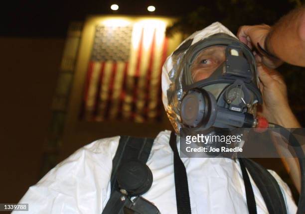 Ralph Madonia from the Fort Lauderdale Fire Rescue Hazardous Materials Response Team secures his Bio Hazard suit October 15, 2001 as he responds to a...