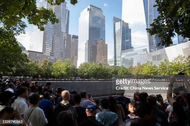 People mourn victims at the National 9/11 Memorial and Museum to commemorate the 20th anniversary of the September 11th terrorist attacks on...