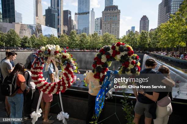 People mourn victims at the National 9/11 Memorial and Museum to commemorate the 20th anniversary of the September 11th terrorist attacks on...