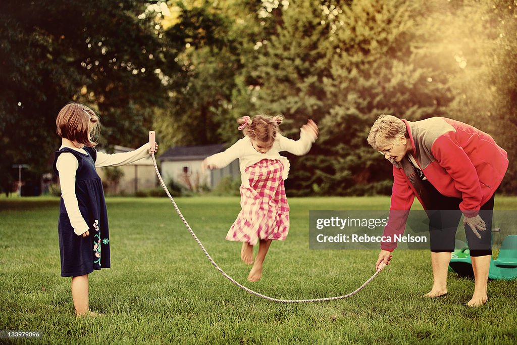 Jump Rope Mama Grandma And Granddaughter Playing Jump Rope High-Res Stock Photo ...
