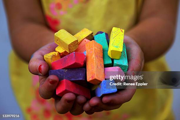 human hand holding pieces of chalk - multi coloured choice stock pictures, royalty-free photos & images