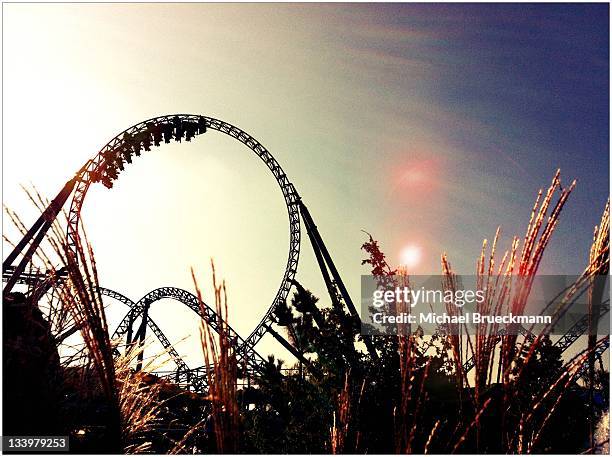 blue fire looping at europapark rust - rust   germany stock pictures, royalty-free photos & images