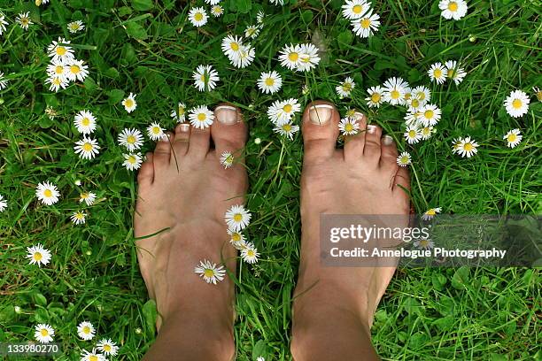 feet standing on grass - barefoot grass stock pictures, royalty-free photos & images