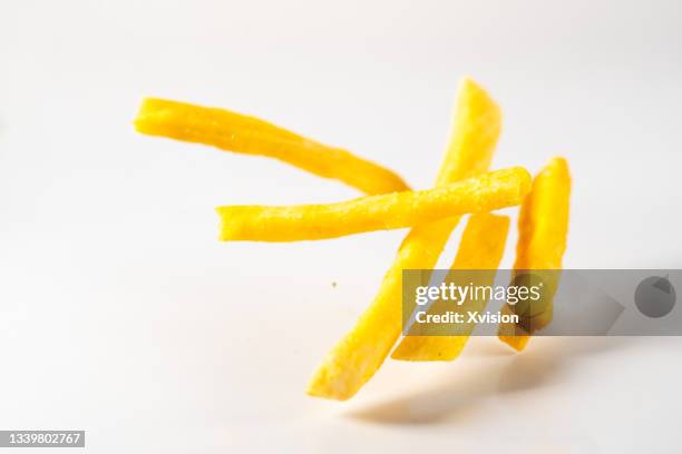 sweet potato dehydrated food in mid-air captured with high speed with white background"n - sweet potato on white stock pictures, royalty-free photos & images