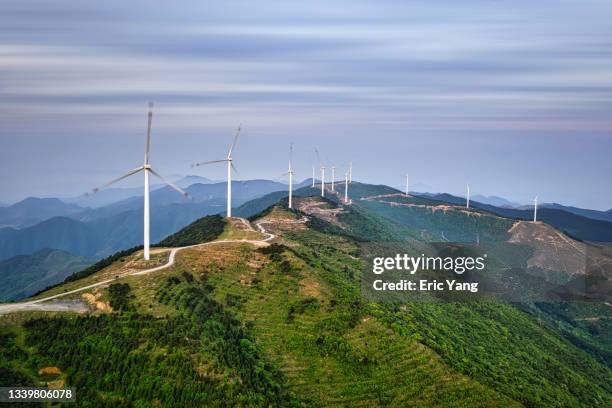 wind farm on top of mountain - sustainable investment stock pictures, royalty-free photos & images