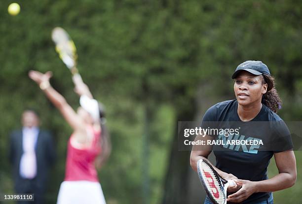 Tennis player Serena Williams stands by to return the ball during a training session in Medellin, Antioquia department, Colombia on November 23,...