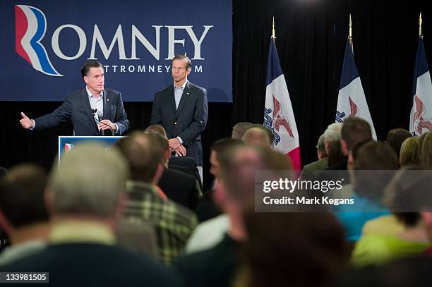 Republican presidential candidate former Massachusetts Gov. Mitt Romney speaks as U.S. Sen. John Thune stands by during an appearance before...