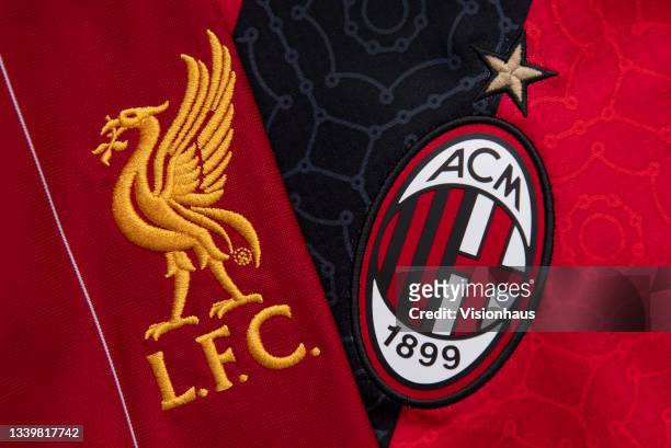 The Liverpool and AC Milan club badges on their first team home shirts ahead of their UEFA Champions League Group B match at Anfield, Liverpool on...