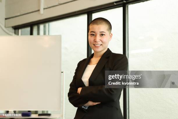 portrait of a non-binary gender business person in asia - nb stock pictures, royalty-free photos & images