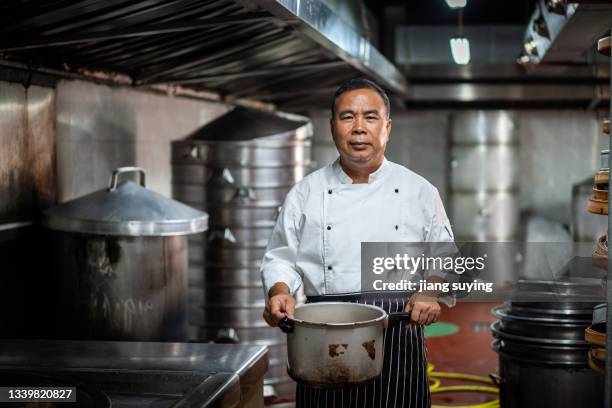 Chef Using Pot Chef Carrying Pot Photos and Premium High Res Pictures - Getty Images