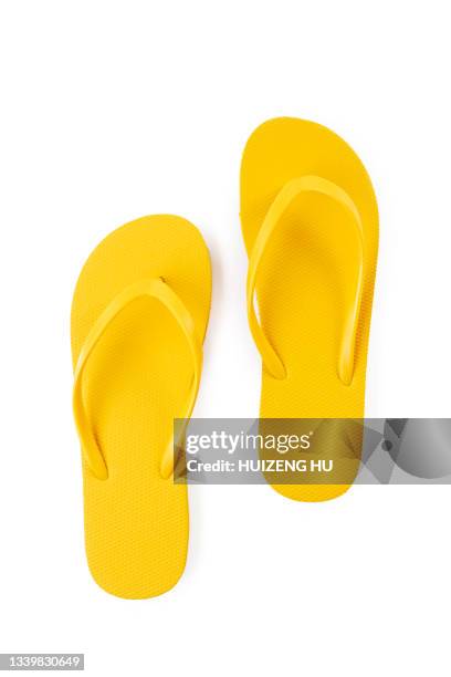 pair of yellow beach flip-flops on white background summer concept - sandal stock pictures, royalty-free photos & images