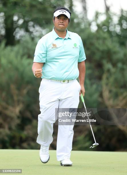 Kiradech Aphibarnrat of Thailand celebrates making an eagle on the 12th hole during Day Four of The BMW PGA Championship at Wentworth Golf Club on...