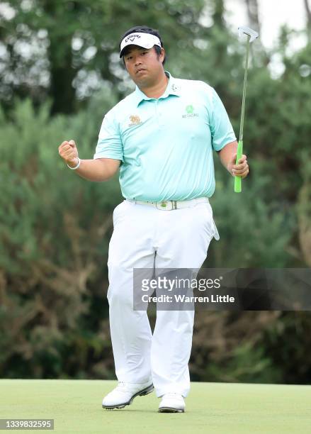 Kiradech Aphibarnrat of Thailand celebrates making an eagle on the 12th hole during Day Four of The BMW PGA Championship at Wentworth Golf Club on...