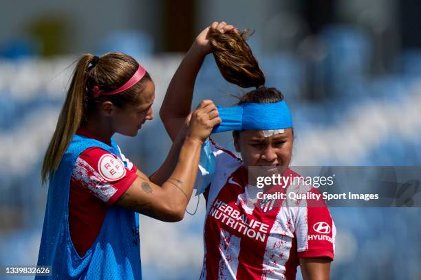 Deyna Castellanos of Atletico de Madrid Women helping Leicy Santos of Atletico de Madrid women after the game during Primera Division Femenina match...