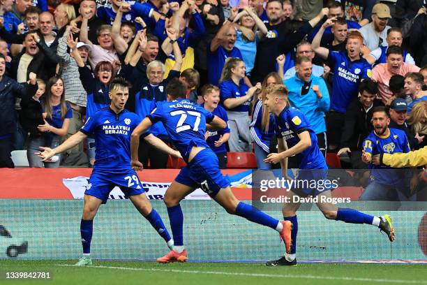 Rubin Colwill of Cardiff City celebrates scoring his sides second goal with Joel Bagan and Mark Harris during the Sky Bet Championship match between...