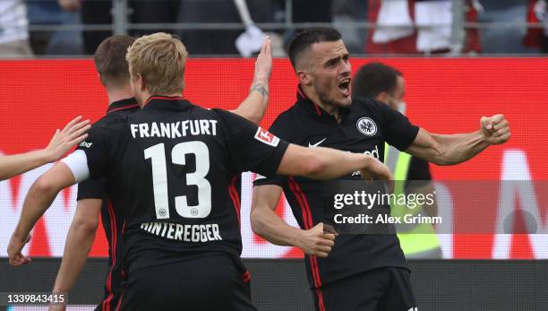 Filip Kostic of Eintracht Frankfurt celebrates his first goal with teammates during the Bundesliga match between Eintracht Frankfurt and VfB...