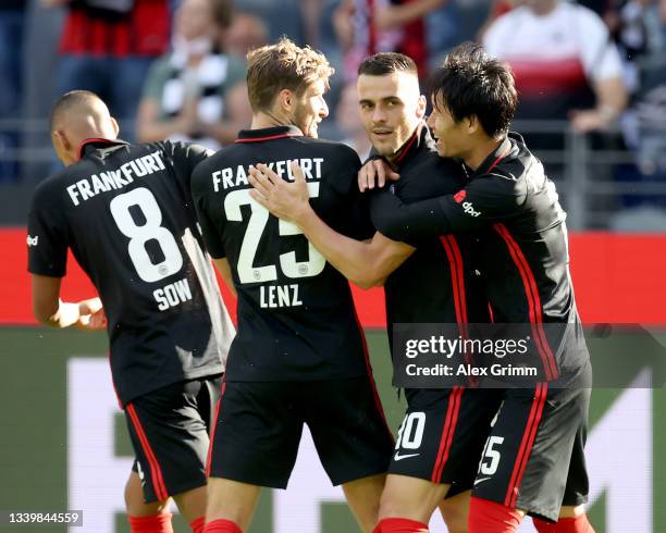 Filip Kostic of Eintracht Frankfurt celebrates his first goal with teammates during the Bundesliga match between Eintracht Frankfurt and VfB...