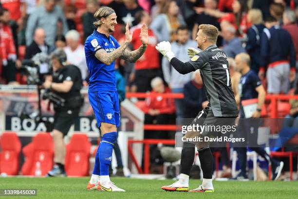 Aden Flint and goalkeeper Dillon Phillips of Cardiff City celebrate at the final whistle following their sides 2-1 win during the Sky Bet...