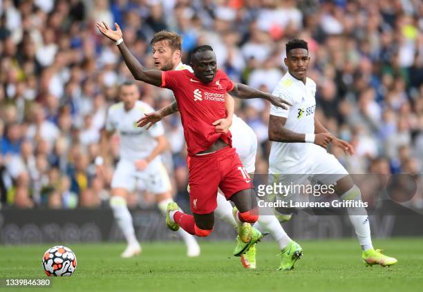 Sadio Mane of Liverpool is fouled by Liam Cooper of Leeds United during the Premier League match between Leeds United and Liverpool at Elland Road on...