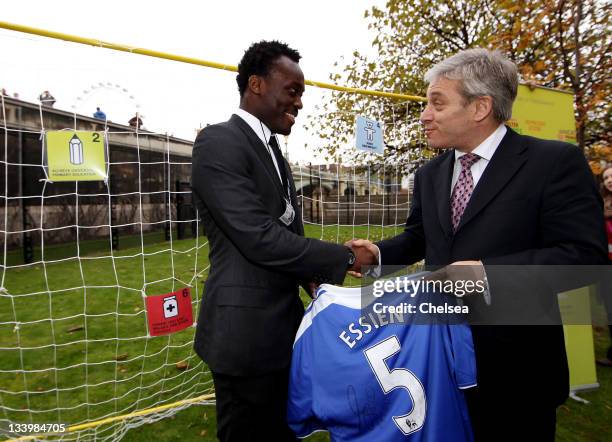 Michael Essien of Chelsea presents John Bercow, Speaker of the House, with a signed Chelsea shirt during a visit to the Houses of Parliament for the...