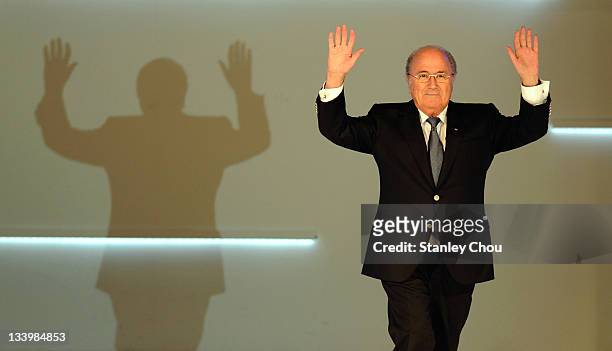 President Joseph S. Blatter waves to the audience as he enters the stage during the 2011 AFC Annual Awards at The Mandrin Oriental Hotel on November...