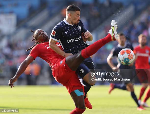 Danilo Soares of VfL Bochum tackles with Dedryck Boyata of Hertha BSC during the Bundesliga match between VfL Bochum and Hertha BSC at Vonovia...