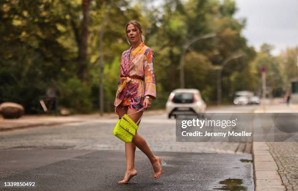 Cheyenne Pahde wearing Zara colofur two Piece and heels, Valentino neon yellow Rockstud bag on September 11, 2021 in Berlin, Germany.