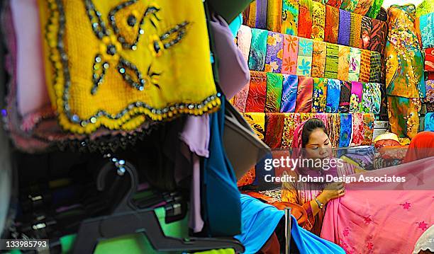 girl seeling batik - malaysia batik stock pictures, royalty-free photos & images