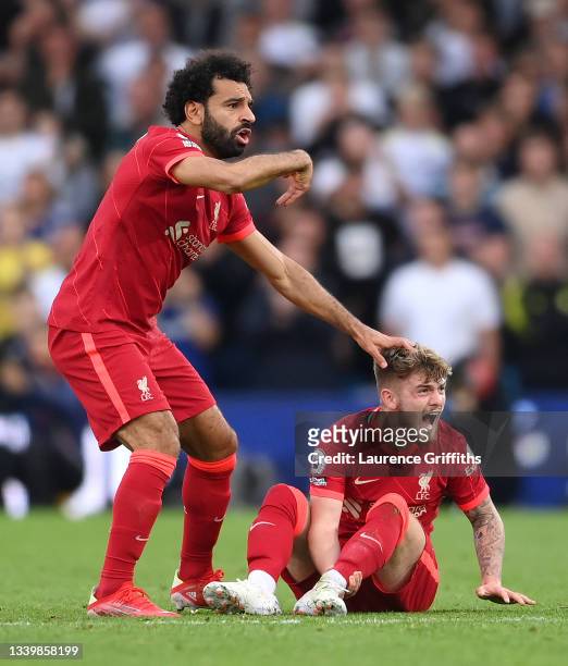 Harvey Elliott of Liverpool reacts as he looks to be injured as Mohamed Salah of Liverpool calls for medical attention during the Premier League...