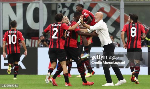 Milan coach Stefano Pioli celebrates the goal during the Serie A match between AC Milan and SS Lazio at Stadio Giuseppe Meazza on September 12, 2021...