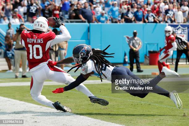DeAndre Hopkins of the Arizona Cardinals catches a 5-yard touchdown pass against the Tennessee Titans during the first quarter at Nissan Stadium on...