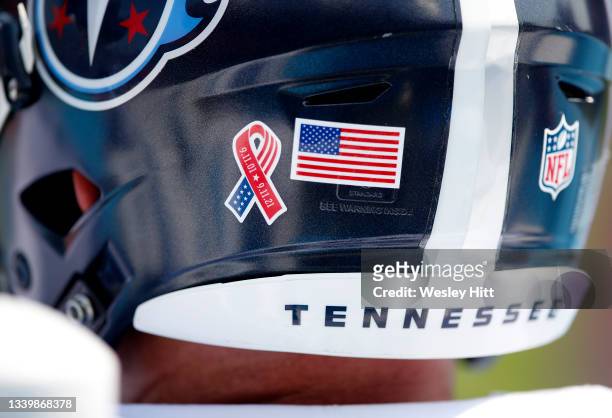 Special logo honoring the September 11th victims is seen on the back of the Houston Texans helmets during their game against the Carolina Panthers at...