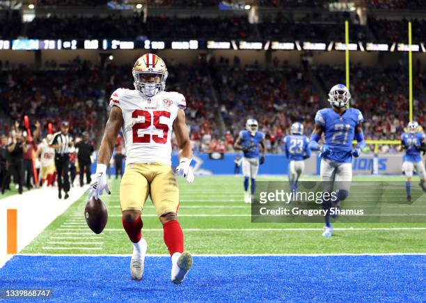 Elijah Mitchell of the San Francisco 49ers celebrates his 38-yard rushing touchdown against the Detroit Lions during the second quarter at Ford Field...