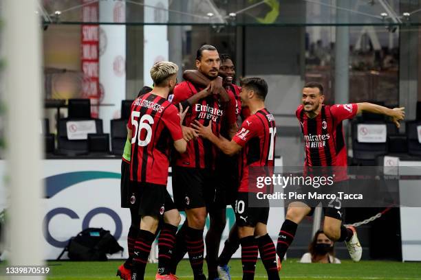 Zlatan Ibrahimović of AC Milan celebrates with teammates after scoring their team's first goal during the Serie A match between AC Milan and SS Lazio...