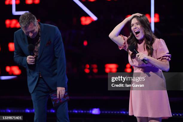 Host Adam Hills performs on stage with Rosie Jones at the National Lottery's ParalympicsGB Homecoming at SSE Arena Wembley on September 12, 2021 in...