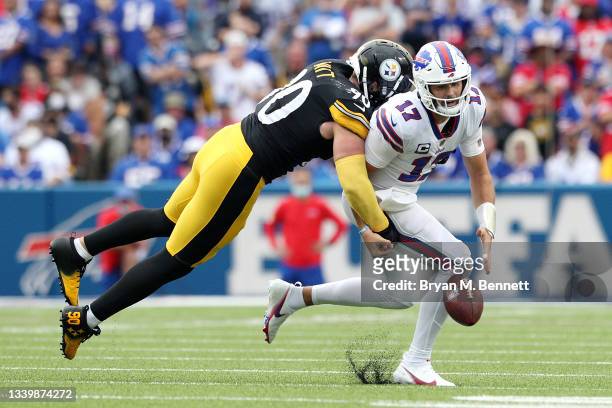 Watt of the Pittsburgh Steelers forces Josh Allen of the Buffalo Bills to fumble during the second quarter at Highmark Stadium on September 12, 2021...