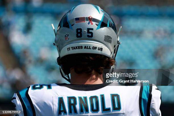 Special logo honoring the September 11th victims is seen on the back of the Carolina Panthers helmets during their game against the Carolina Panthers...