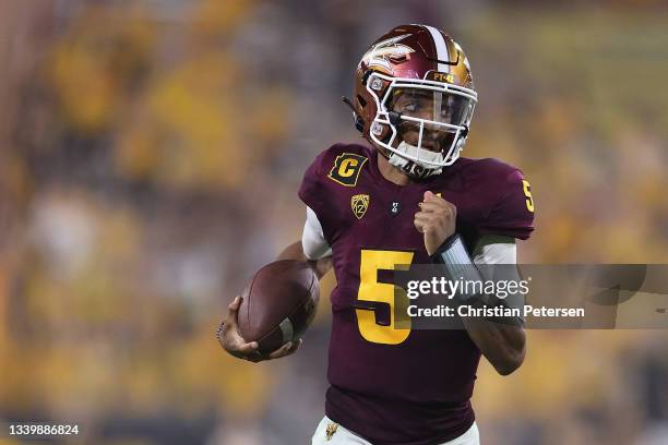 Quarterback Jayden Daniels of the Arizona State Sun Devils rushes the football against the UNLV Rebels during the second half of the NCAAF game at...