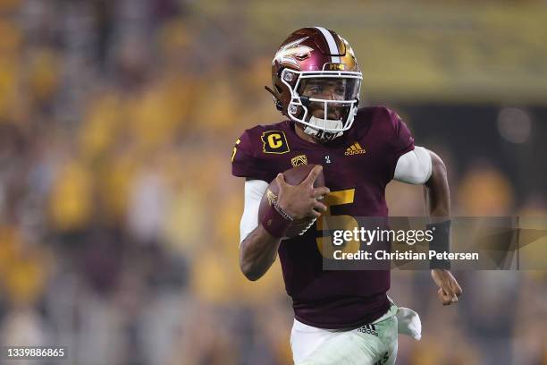 Quarterback Jayden Daniels of the Arizona State Sun Devils rushes the football against the UNLV Rebels during the second half of the NCAAF game at...