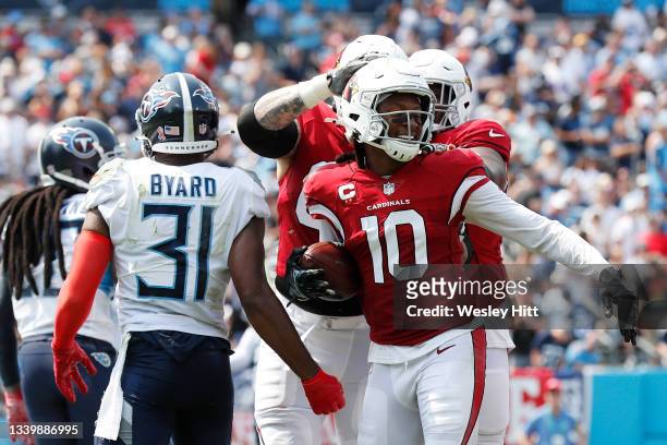 DeAndre Hopkins of the Arizona Cardinals celebrates after scoring his second touchdown of the game during the second quarter against the Tennessee...