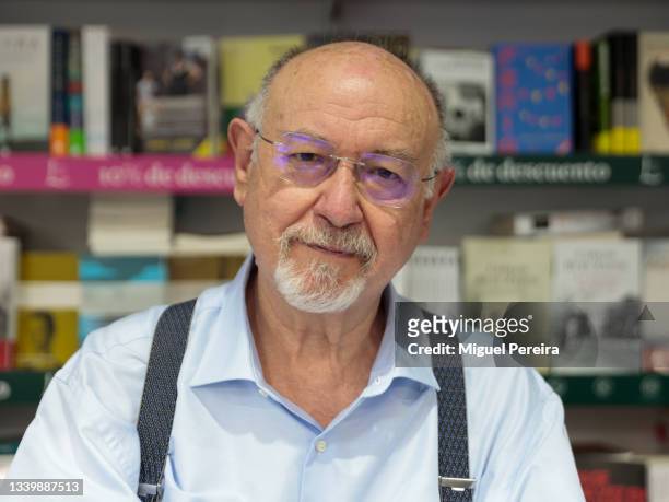 Spanish writer Juan Eslava Galán poses during the signing of his latest book, "La tentación del Caudillo", at the Madrid Book Fair on September 12,...